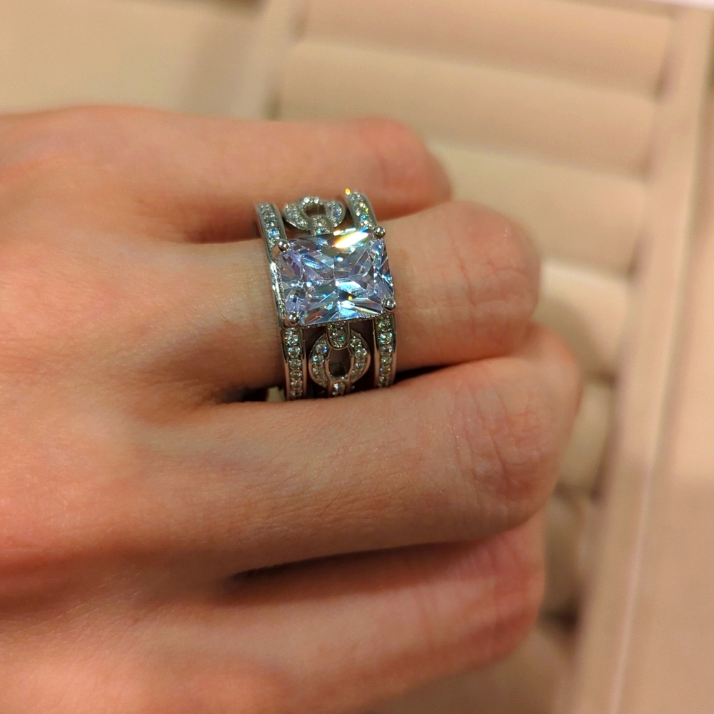 Cubic zirconia engagement style ring with removable pave set chain link band.